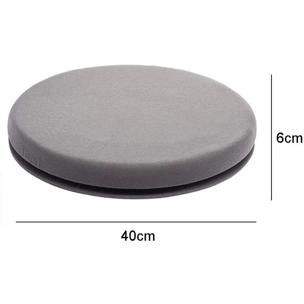 Grey rotating car seat cushion with plush fabric on a car seat, showing swivel function.
