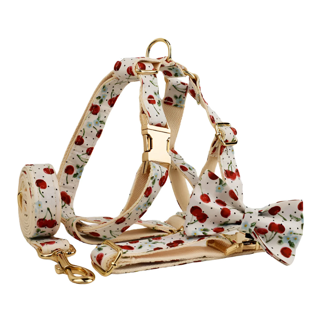 Red cherry print dog collar and leash set with light gold metal buckle and attached cloth bow