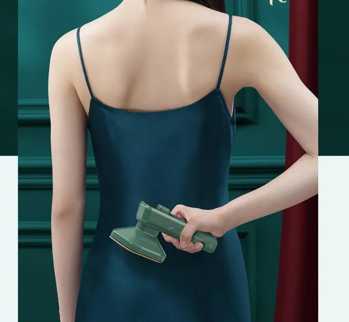 Dark green portable hanging ironing machine with ceramic panel and handheld design.