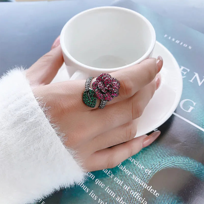 Black gold geometric flower ring with simulated red corundum stones on copper base