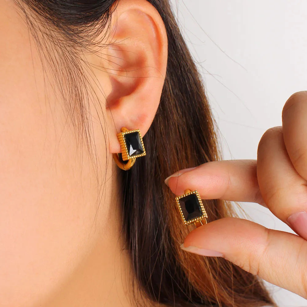 Square zircon stainless steel earrings in geometry design with round ring details, shown in white colour.