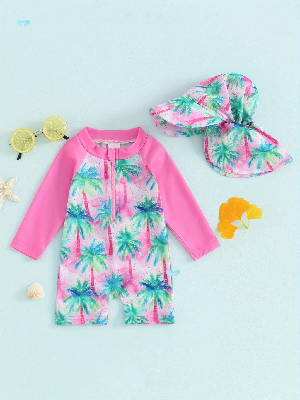 Green polypropylene fibre one-piece long-sleeve baby swimsuit with matching hat on neutral background