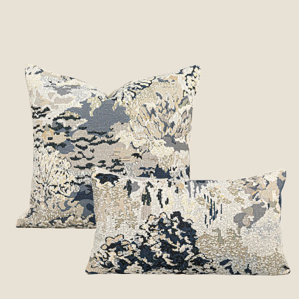 Antique blue floral patterned pillow on a sofa, shown in square and rectangular waist pillow sizes.