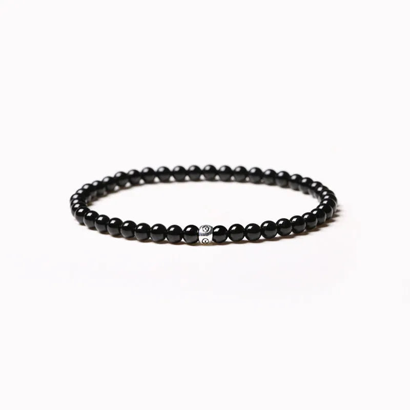 Unisex geometric agate bracelet with 4mm stones and adjustable clasp in black, blue, or obsidian.