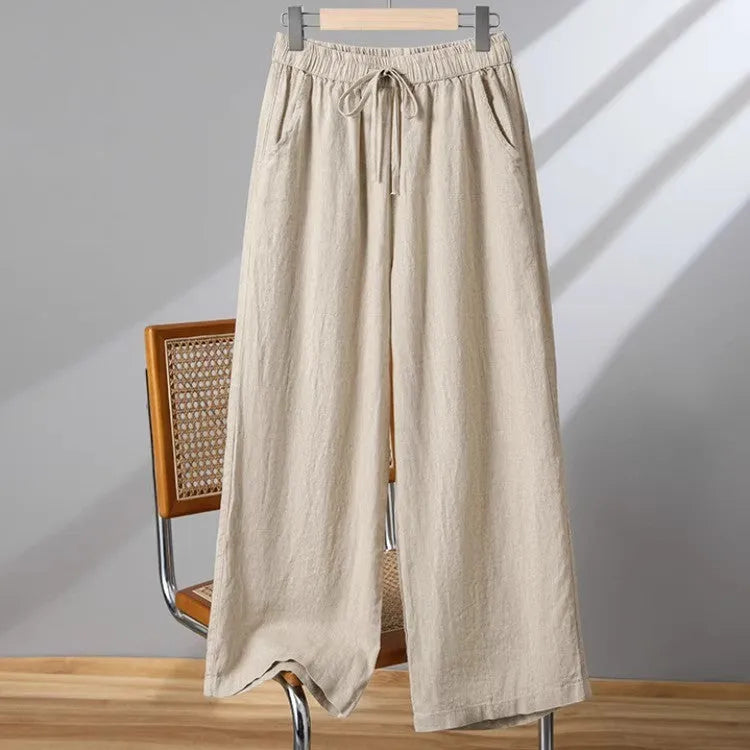 Women's apricot-coloured straight-leg casual trousers with an elastic waistband and white lace-up drawstring detail.