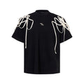 Black loose-fit short-sleeved T-shirt with ribbed padded shoulders on a hanger.