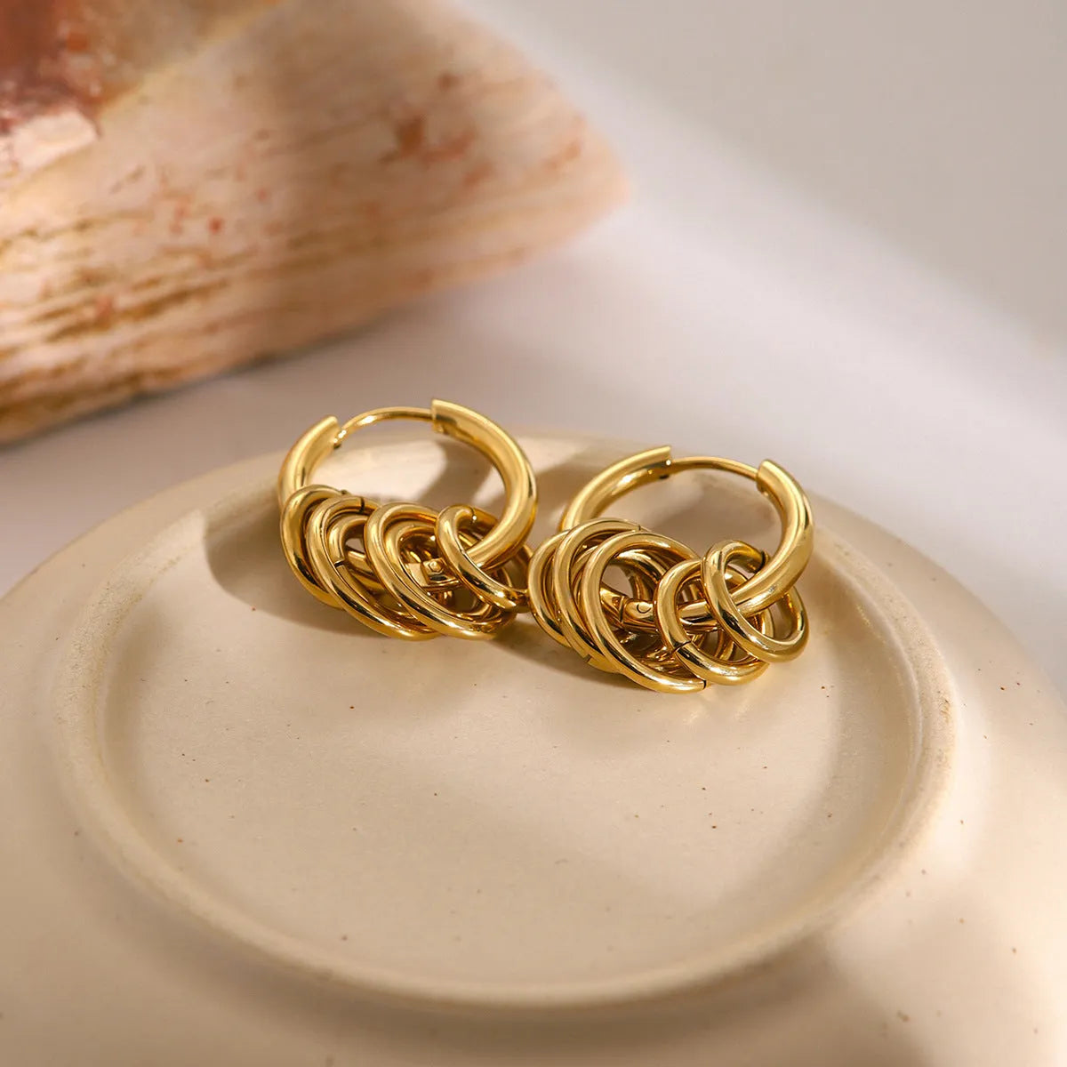 Stainless steel electroplated ins style earrings in gold or silver tone on a plain background.