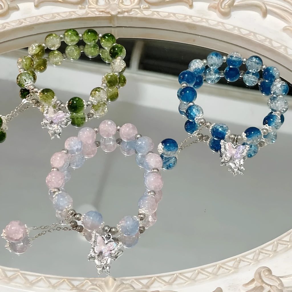 Handmade glass bead bracelet with fairy butterfly broken beads design on white background