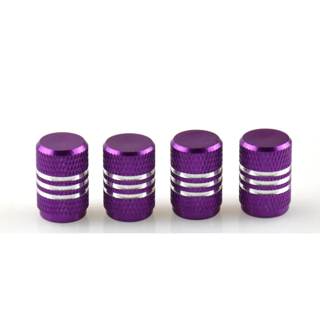 Set of stainless steel car tyre valve caps in multiple colours including red, blue, black, and silver.