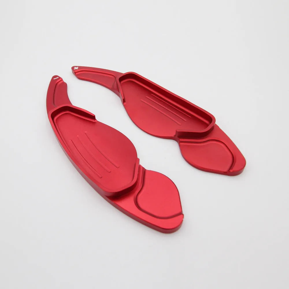 Aluminium alloy steering wheel shift paddles in silver, red, blue, and black for universal car interior modification.