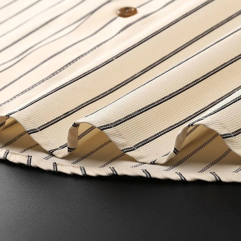 Coffee coloured striped men's long-sleeved shirt with a slim fit, shown on a hanger.