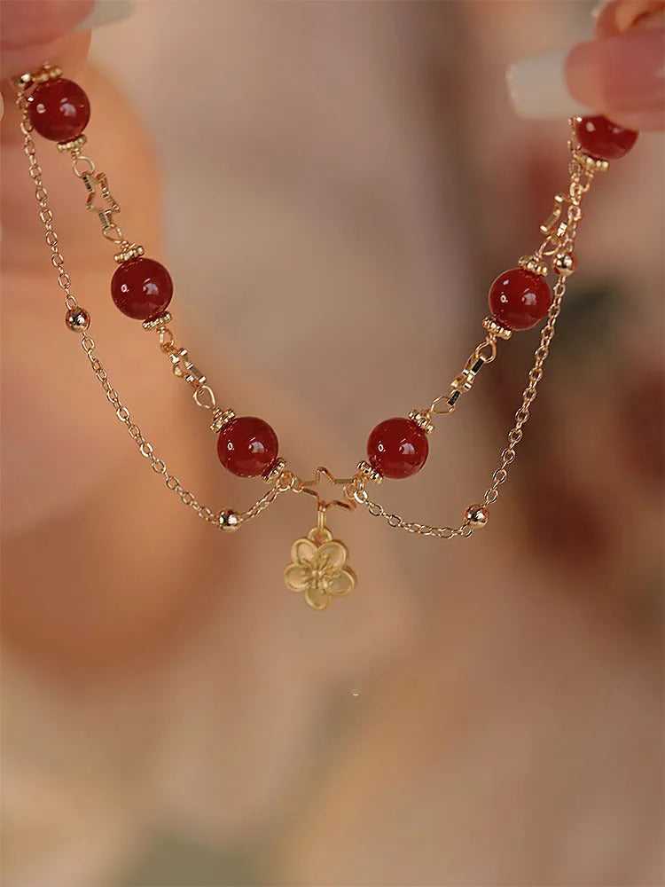 Women's red agate bracelet with double layer design and peach blossom floral elements
