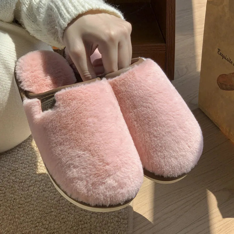 Blue unisex winter plush PVC house slippers with car stitching and a non-slip sole.