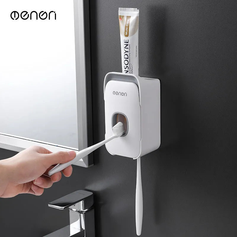 Automatic toothpaste dispenser mounted on bathroom wall in blue colour with touchless sensor