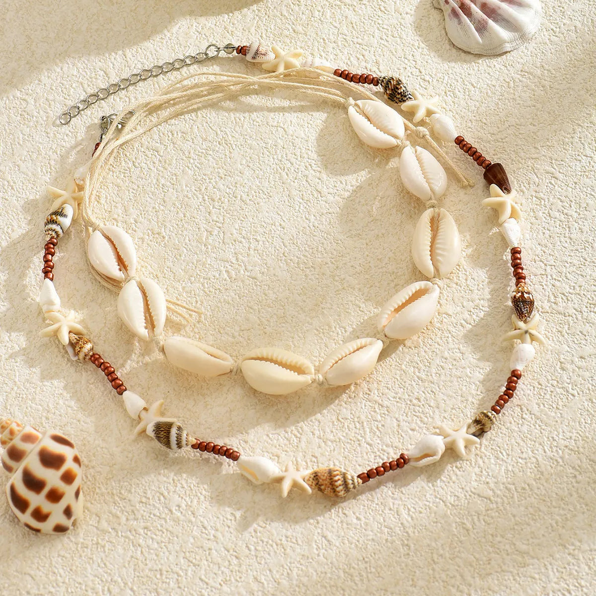 Women's bohemian shell necklace with geometric pendant on regular chain in colour X1900