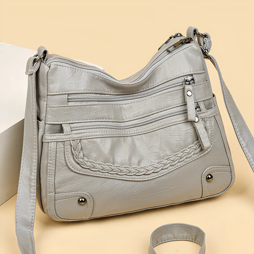 Soft PU messenger bag in horizontal square shape with multiple pockets and sewing thread detailing