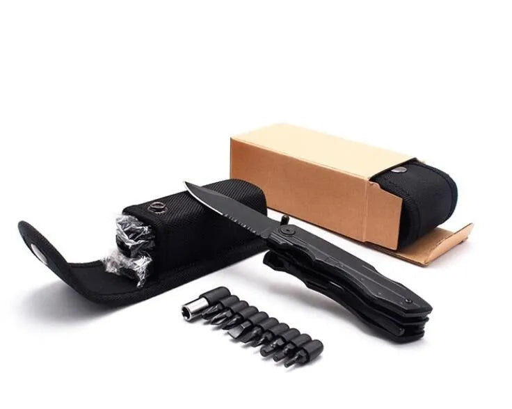 Black multi-purpose folding pliers tool with 7.5cm blade and aluminium handle on a flat surface