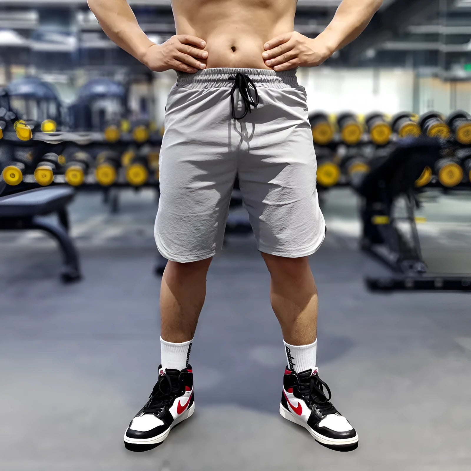 Men's black quick-dry running shorts with contrast blue stitching, shown flat.