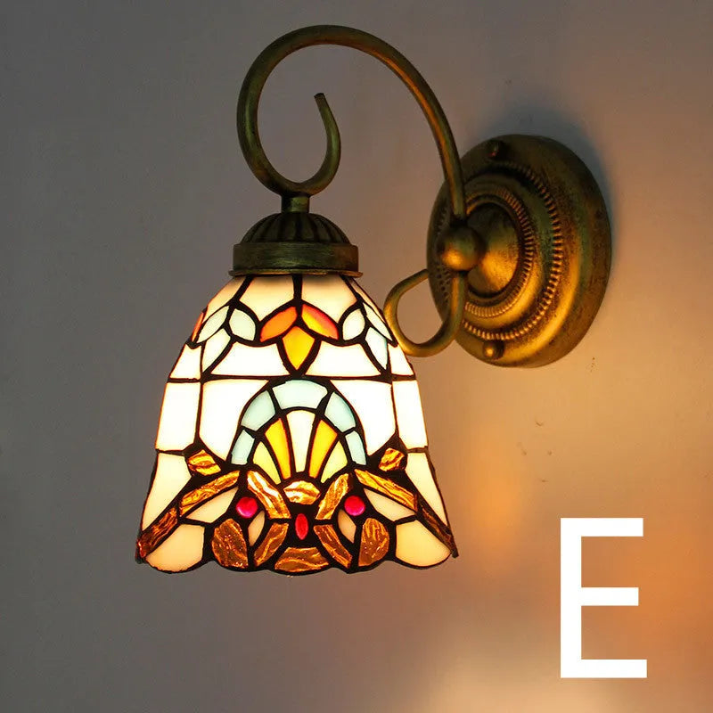 A coloured stained glass wall lamp designed for mounting in a corridor or hallway.