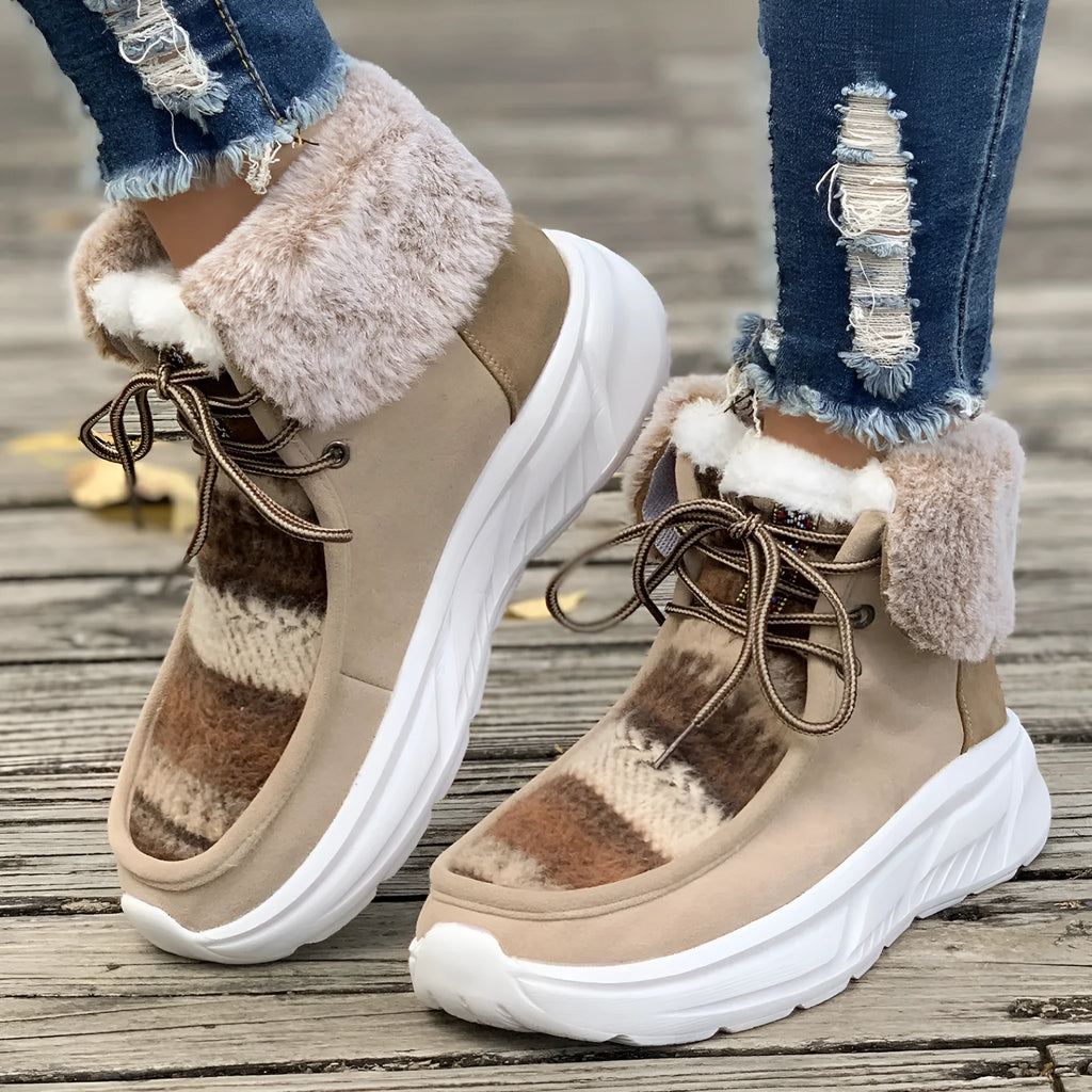 Beige women's lace-up mid-top snow boots with suede upper and thick rubber sole.