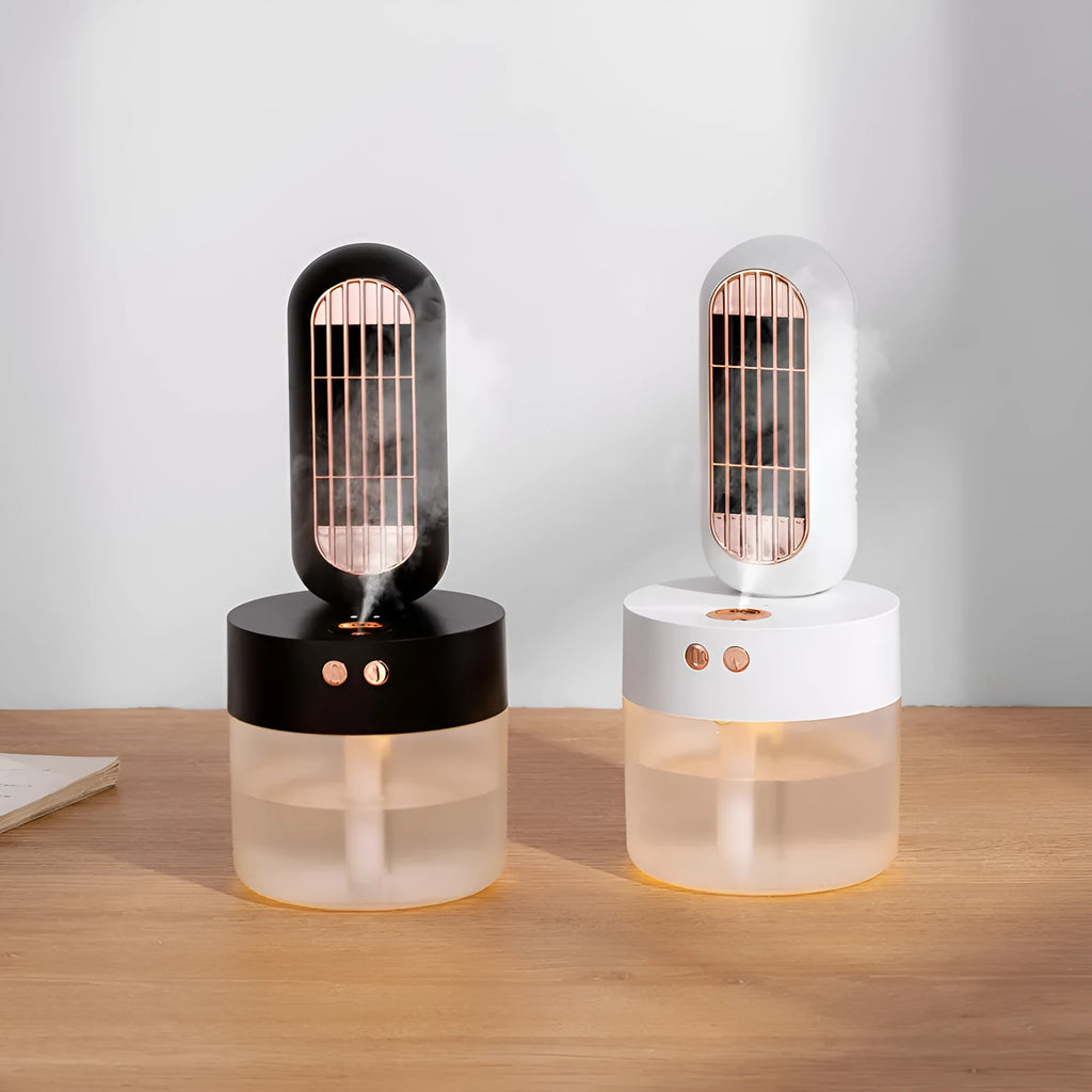 Small black and white oscillating humidifier fan with mechanical controls on desktop