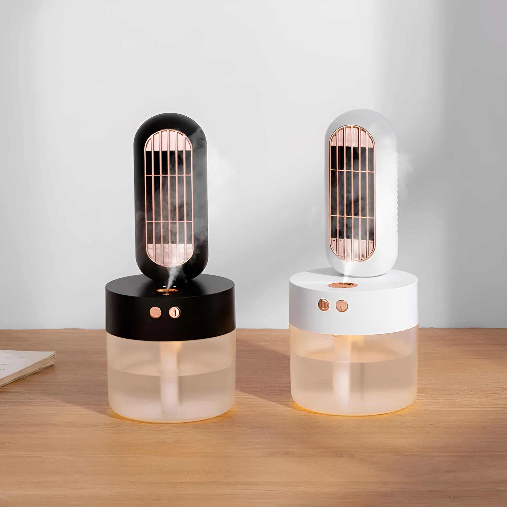 Small black and white oscillating humidifier fan with mechanical controls on desktop