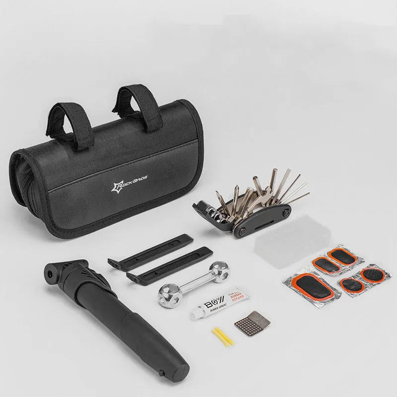 Bicycle puncture repair kit with maintenance tools in a frame-mounted storage set for the upper tube