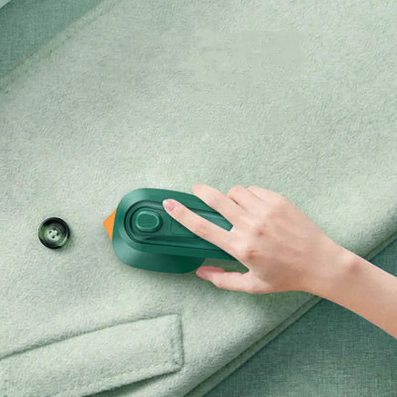 Dark green portable hanging ironing machine with ceramic panel and handheld design.