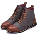 Men's large black leather motorcycle boots with silver belt buckle closures on a rubber sole.