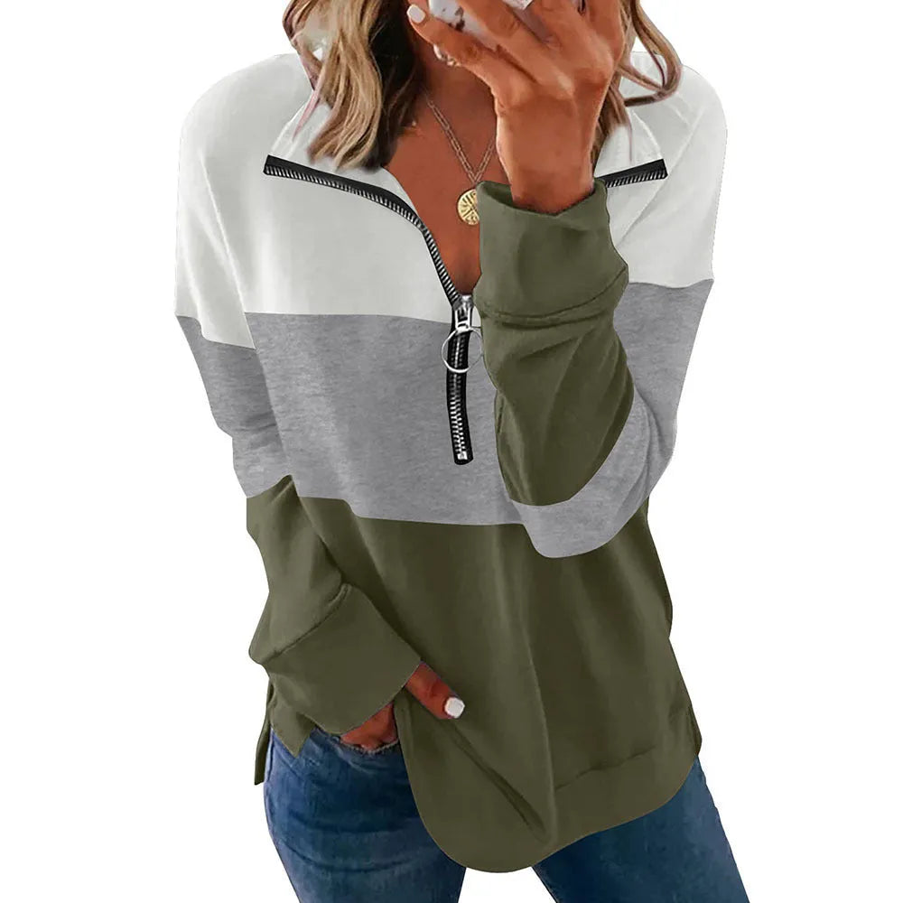 Women's loose fit long-sleeved leopard print sweater in polyester fabric on a hanger