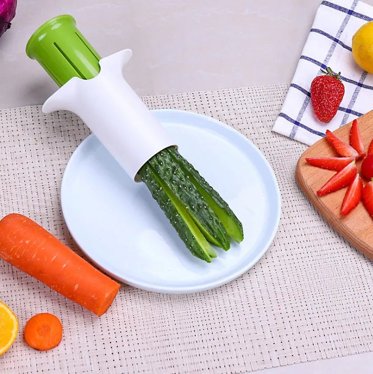 White ABS plastic vegetable slicer with stainless steel blades for cucumbers, carrots, and strawberries