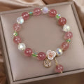 Double layer strawberry quartz bracelet with lucky cat charm in red cat's eye flowers colour