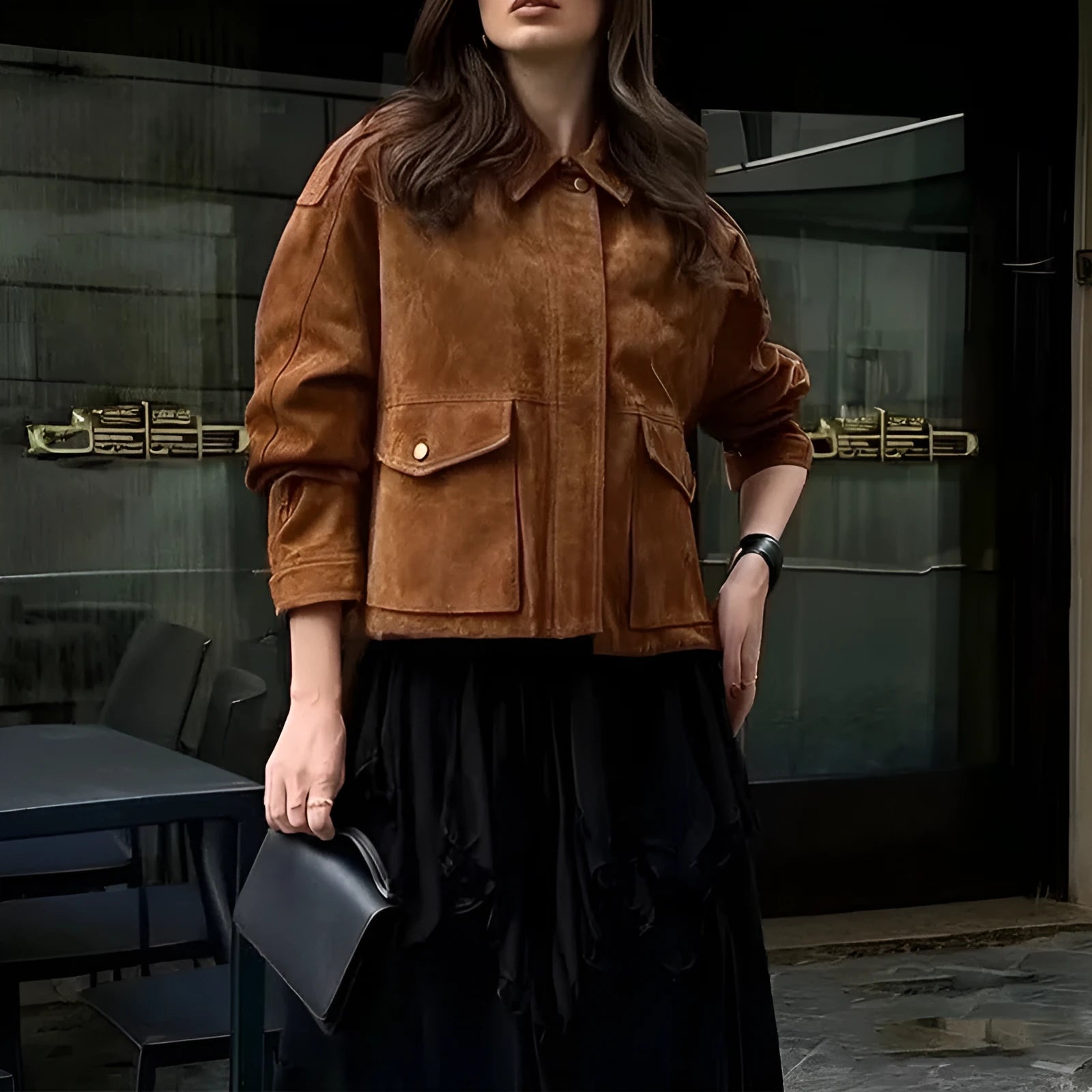 Women's brown suede coat with regular sleeves on a hanger.