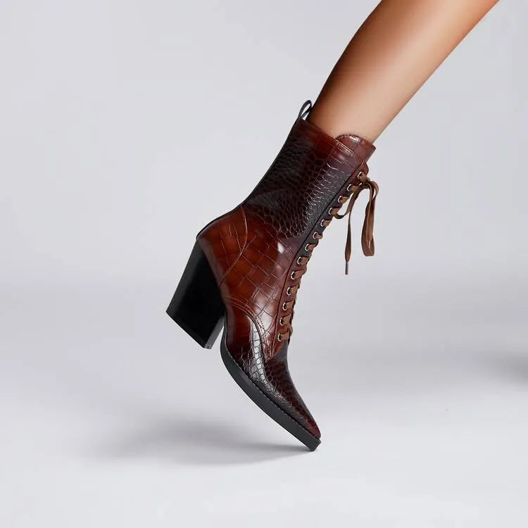 Dark brown retro pointed toe ankle boots with lace detailing and a chunky heel on a white background.