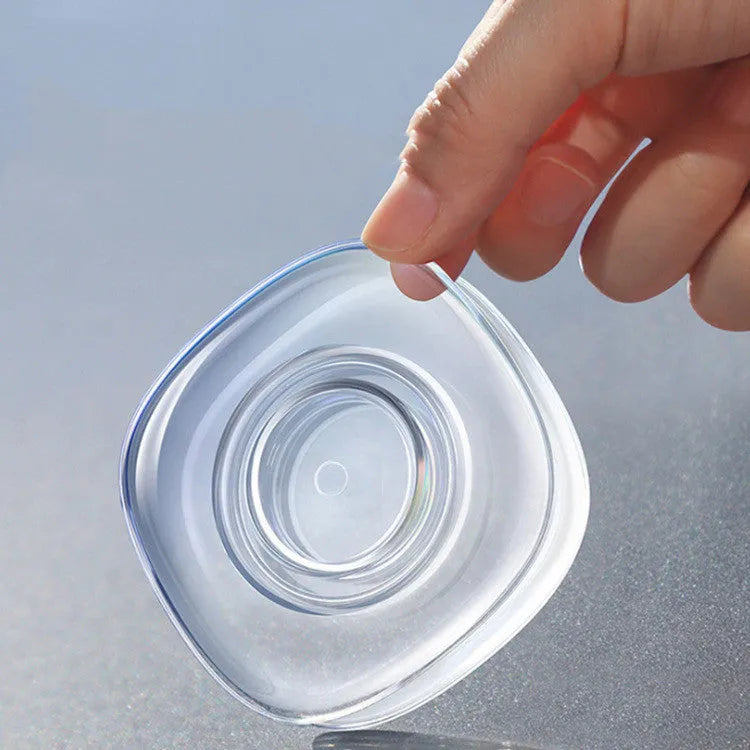Transparent silicone nano gel adhesive pads in circle and square shapes on a dashboard.