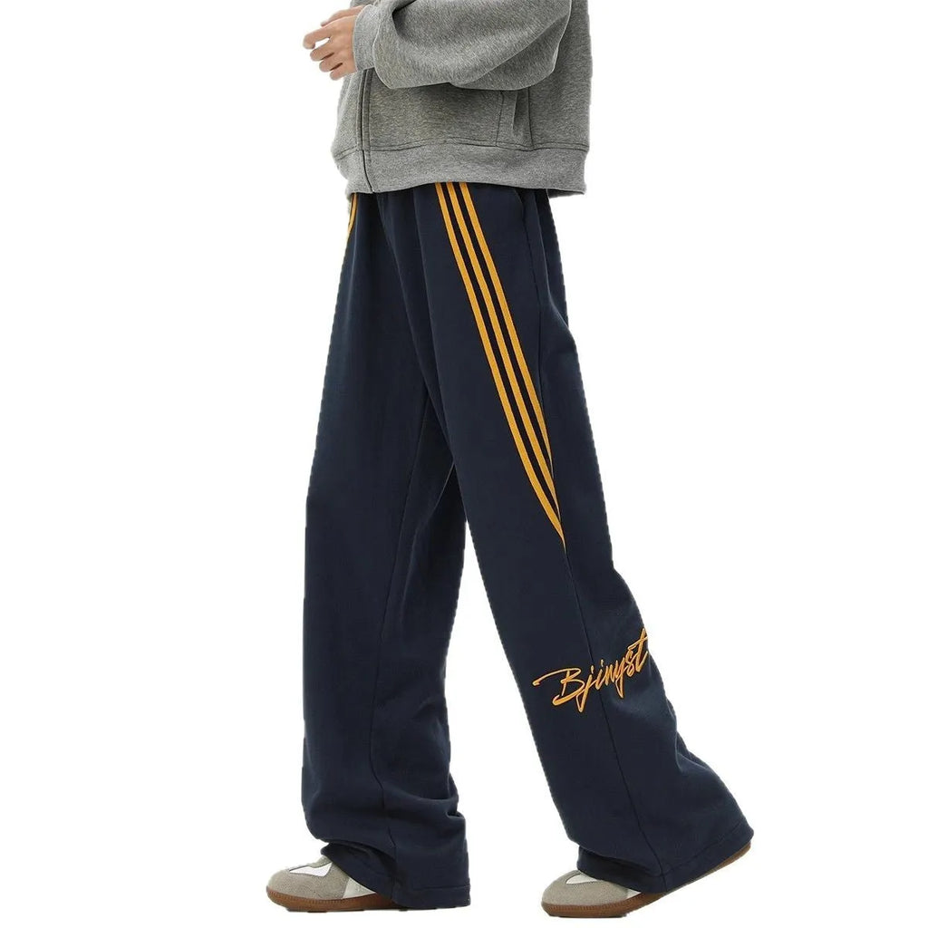 Men's striped loose straight-leg casual pants in black, white gray, or navy blue, polyester stretch fabric, sizes M to XXXL