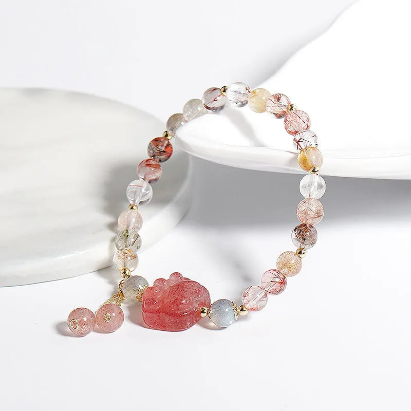 Women's natural crystal bracelet with manual craftsmanship showing animal zodiac designs