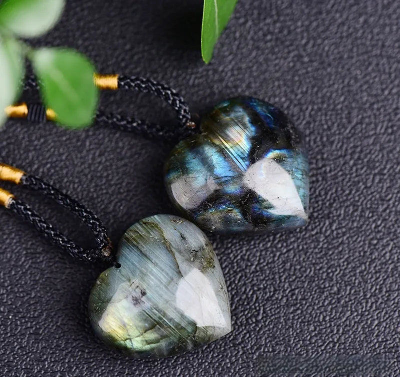 Blue light natural crystal heart pendant necklace on a silver chain, showing size options.