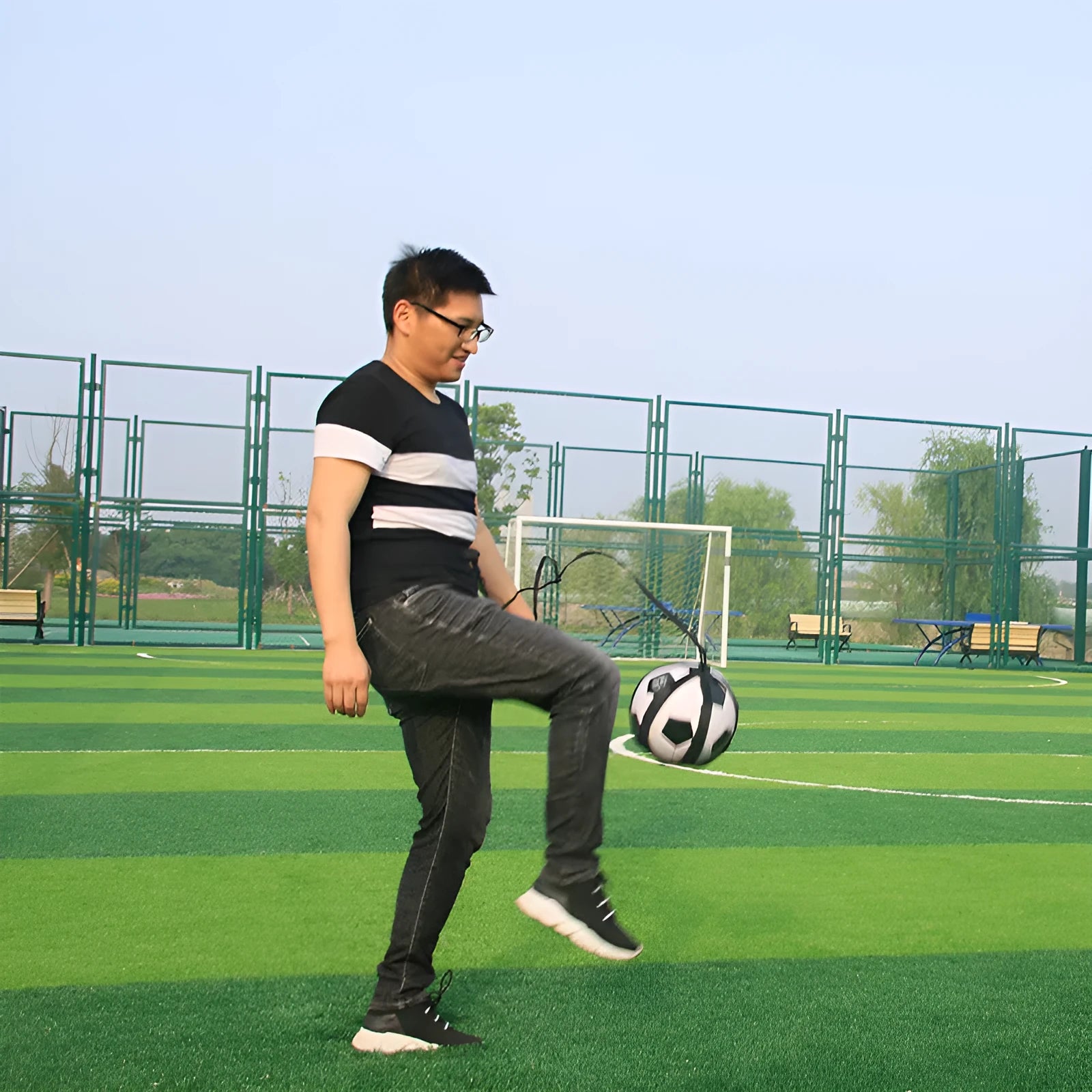 Black football juggling belt with rotating mechanism and 2 metre training cord