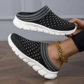 Women's black striped Flyknit slipper shoes with hollowed-out design on a viscose sole.