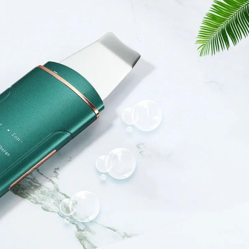 Ultrasonic skin rejuvenation whitening shoveling machine in ivory white with handheld design and shovel knife.