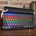 Black dot retro style mechanical keyboard with colourful backlit keys on a desk.