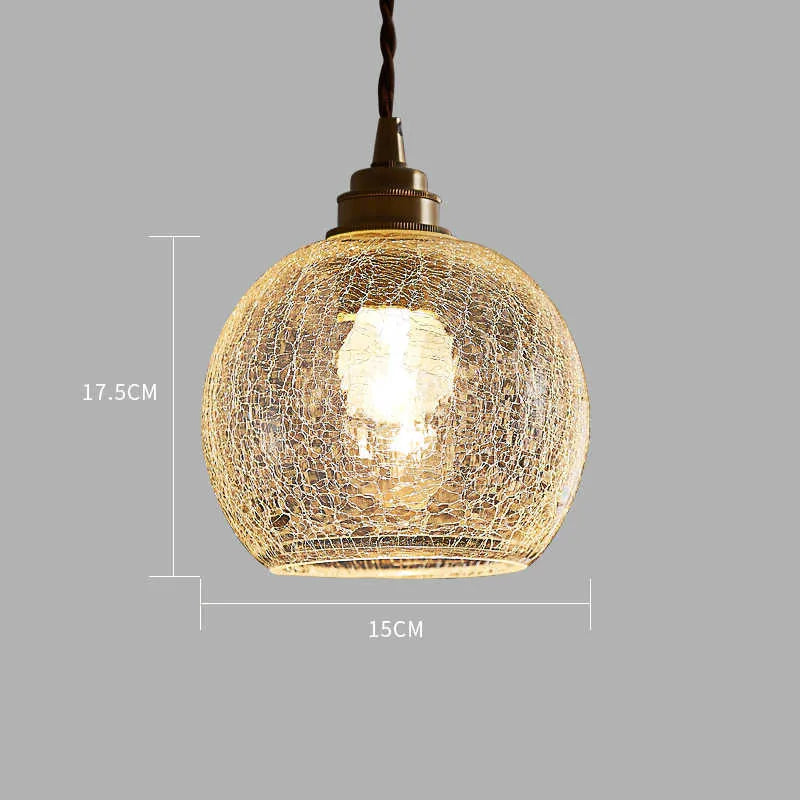 Retro brass ceiling chandelier with a clear glass ball shade, showing copper construction.