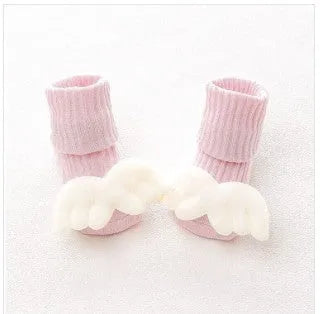 Cotton baby socks with non-slip soles in multiple designs including bows, stars, and animal prints.