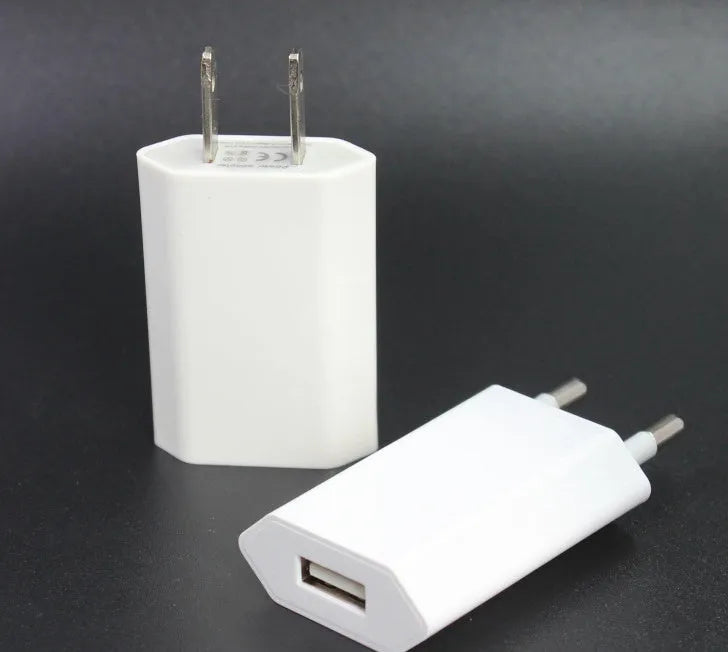 USB travel charger with Apple-compatible charging cable showing 5V 2A output and 220V UK input specifications