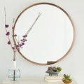 Round Nordic style bathroom wall mirror with iron frame in black, white, or gold colour, 30cm diameter.