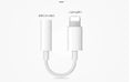 White Lightning to 3.5mm female headphone jack adapter for iPhone compatibility.