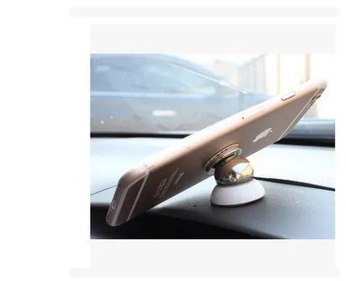 Black magnetic car phone mount on dashboard holding a smartphone with strong magnet support