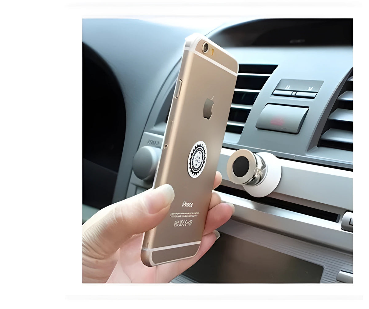 Black magnetic car phone mount on dashboard holding a smartphone with strong magnet support