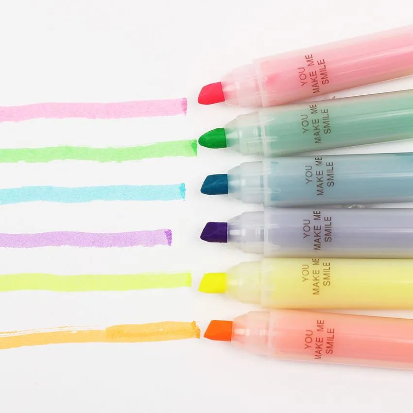 Set of six plastic barrel highlighter pens with chisel tips in six different colours, showing oblique pen shape.